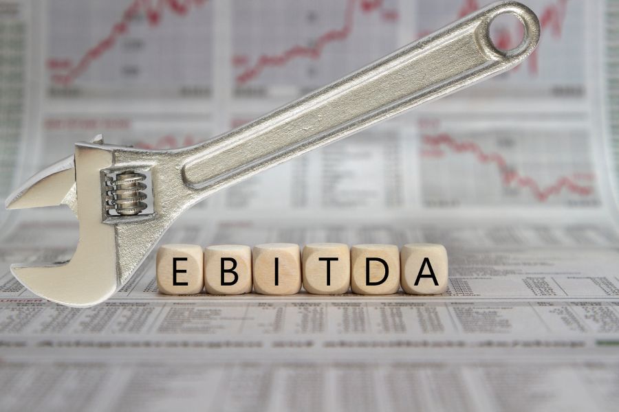 A wrench being used to adjust EBITDA